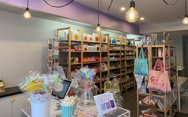 Bakery shop interior in Lausanne with shelves of baking supplies and decorative cookies.