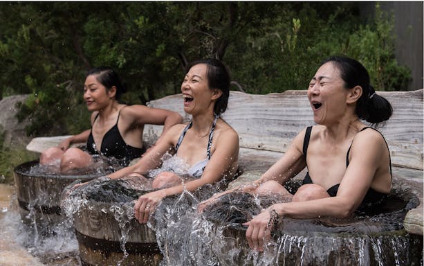 Women enjoying hot springs at Peninsula Hot Springs tour.