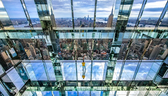 SUMMIT One Vanderbilt observation deck view with New York City skyline and walking tour group.