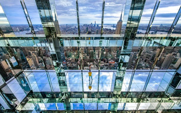 SUMMIT One Vanderbilt mirrored observation deck with New York City skyline.