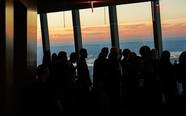 Visitors at One World Observatory during sunset, New York City.