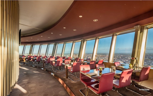 Dining area with panoramic city views inside Berlin TV Tower.