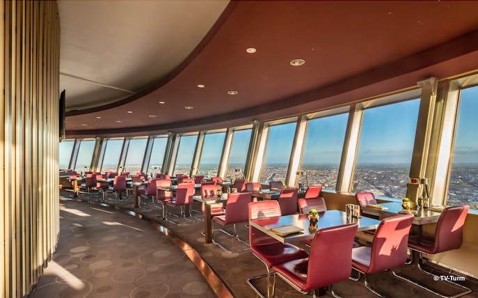 Dining area with panoramic city views inside Berlin TV Tower.