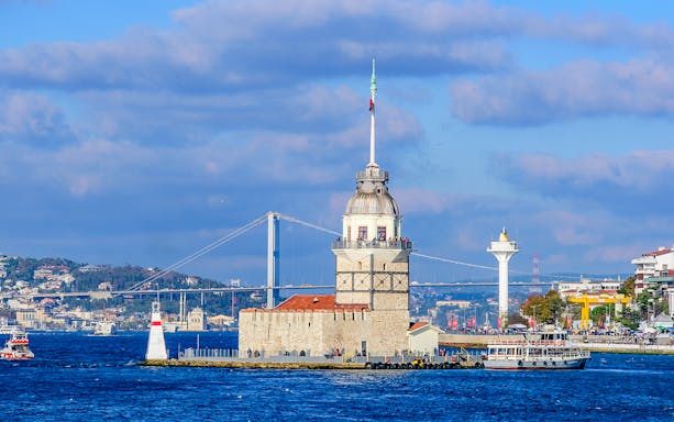 Maiden's Tower on Bosphorus with cruise boat, Istanbul sightseeing tour.