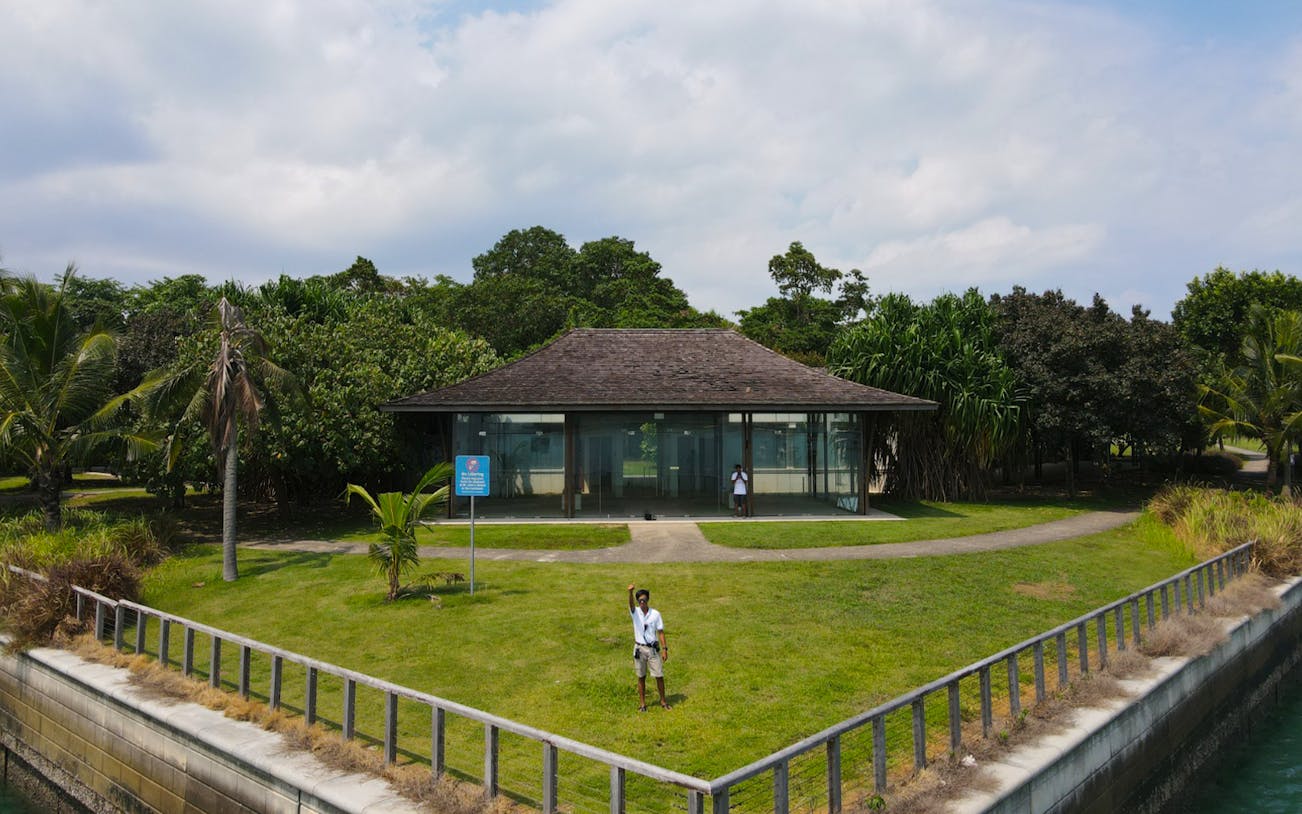Seaside pavilion surrounded by lush greenery on The Seafarer's Channel Tour.