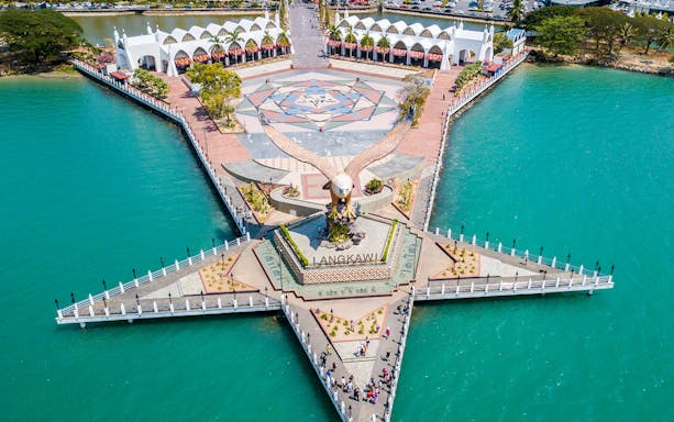 Aerial view of Eagle Square on Langkawi Island, featuring a large eagle statue and surrounding waterfront.