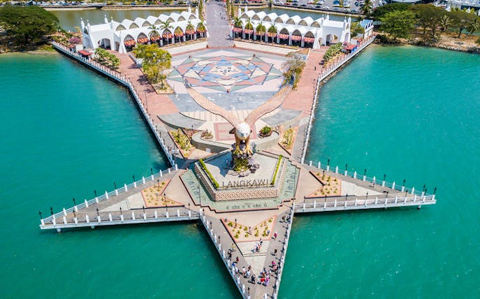 Aerial view of Eagle Square on Langkawi Island, featuring a large eagle statue and surrounding waterfront.