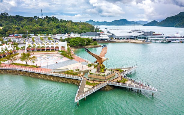 Aerial view of Eagle Square on Langkawi Island, featuring a large eagle statue by the waterfront.