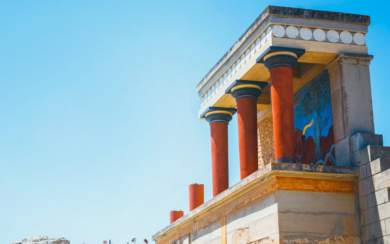 Knossos Palace with red columns and fresco, Crete, Greece.
