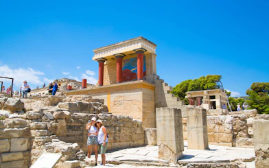 Guests exploring the ancient ruins of Knossos Palace in Crete.