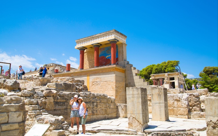Guests exploring the ancient ruins of Knossos Palace in Crete.