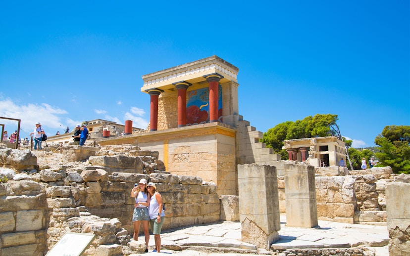 Guests exploring the ancient ruins of Knossos Palace in Crete.