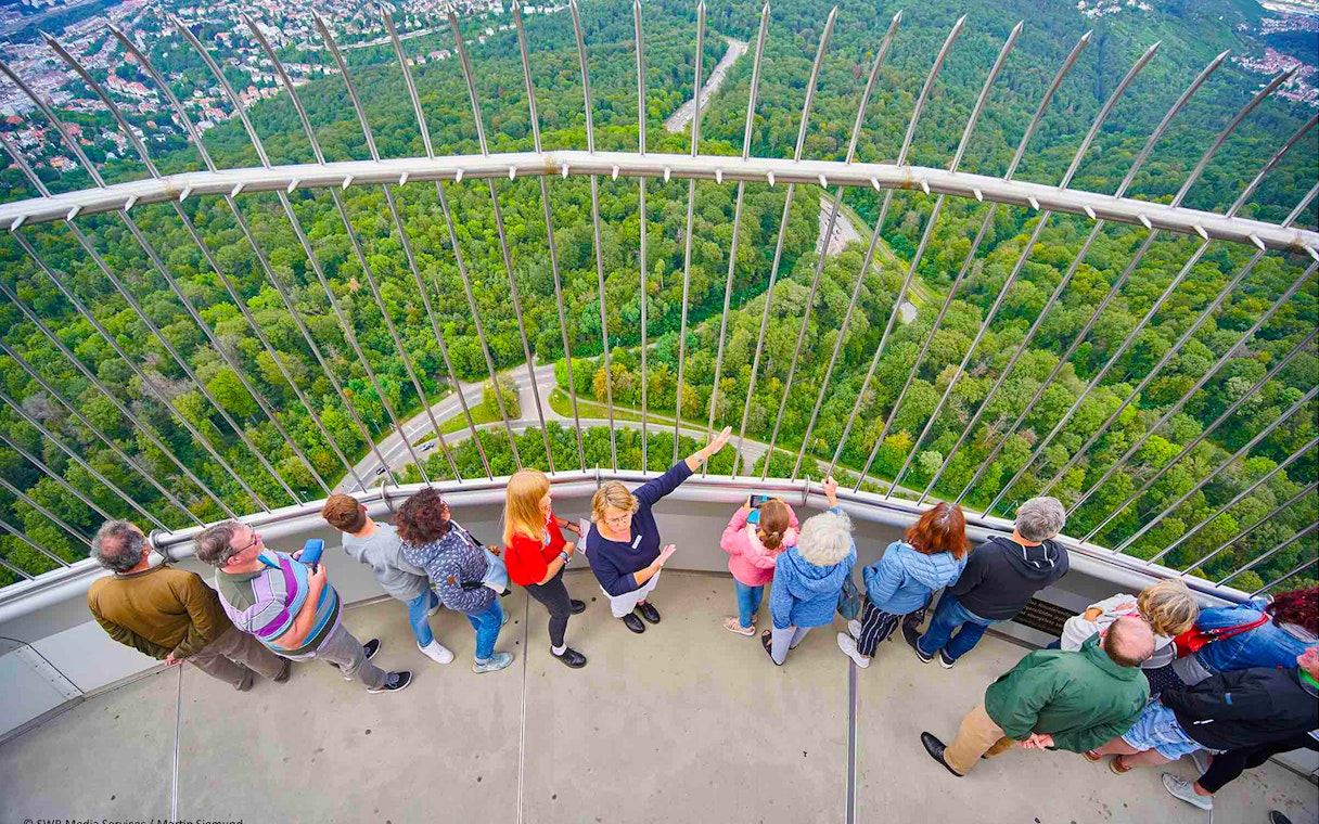 Visitors enjoying the view from the observation deck of Fernsehturm Stuttgart.