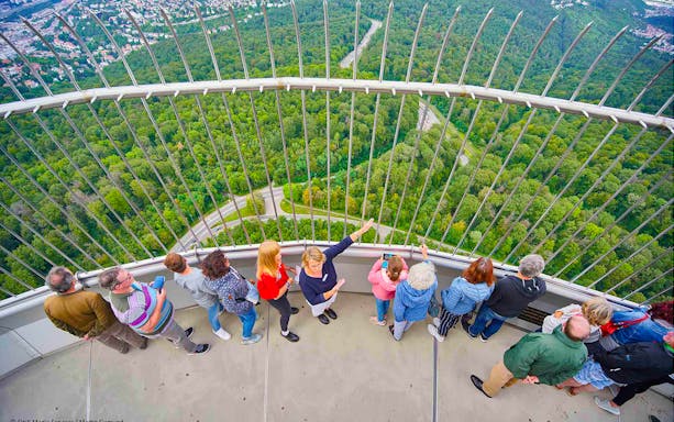 Visitors enjoying the view from the observation deck of Fernsehturm Stuttgart.