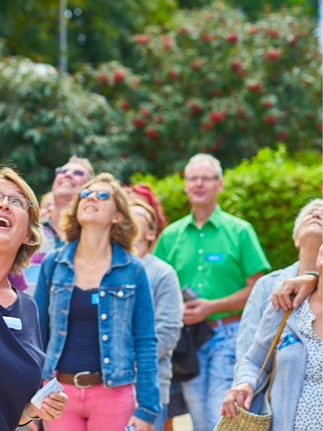 Group of tourists looking up at the Fernsehturm Stuttgart.