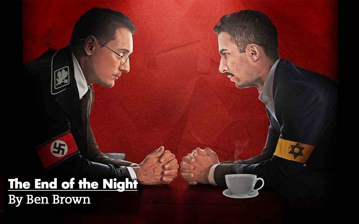 Two men facing each other over a table, one with a Nazi armband, the other with a Star of David armband.
