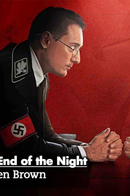 Two men facing each other over a table, one with a Nazi armband, the other with a Star of David armband.
