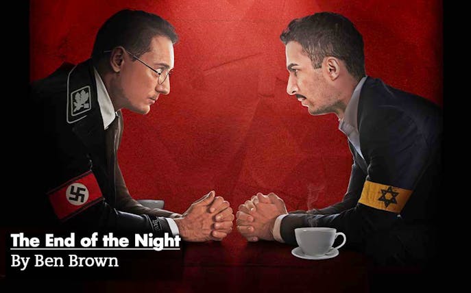 Two men facing each other over a table, one with a Nazi armband, the other with a Star of David armband.