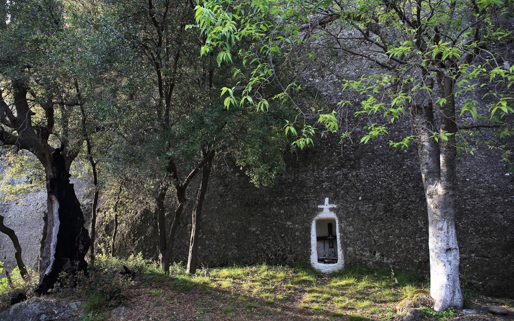 Hidden shrine in forest along Meteora hiking trail, Greece.
