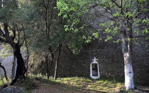 Hidden shrine in forest along Meteora hiking trail, Greece.