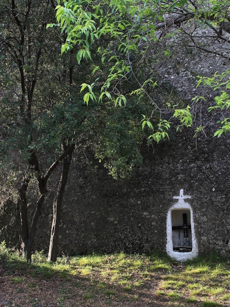 Hidden shrine in forest along Meteora hiking trail, Greece.