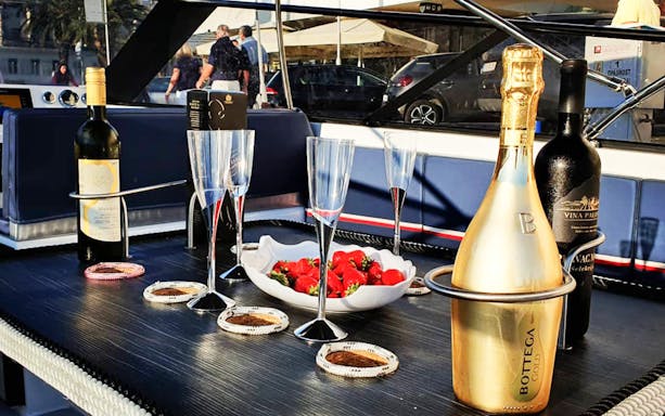 Champagne and strawberries on a boat deck during Split's Blue Cave, Vis, and Hvar tour.
