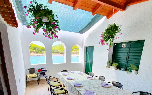 Dining area with sea view on a Split boat tour to Blue Cave, Vis, and Hvar.