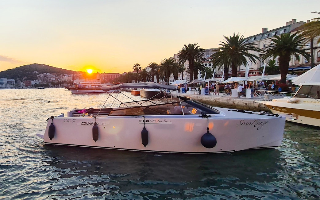 Boat docked at Split harbor at sunset, starting point for Blue Cave, Vis, and Hvar tour.