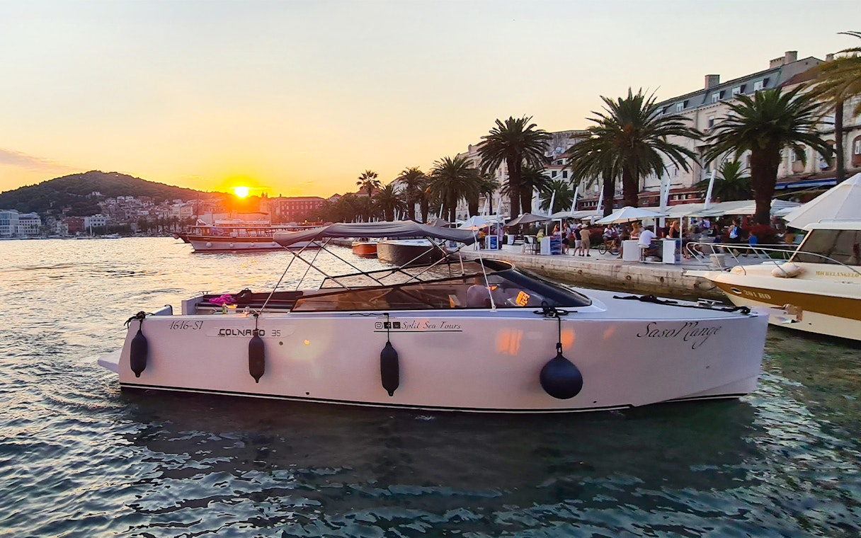 Boat docked at Split harbor at sunset, starting point for Blue Cave, Vis, and Hvar tour.