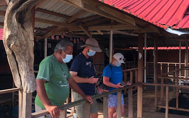 Visitors observing fish farm during Langkawi UNESCO Geopark Mangrove Discovery Tour.