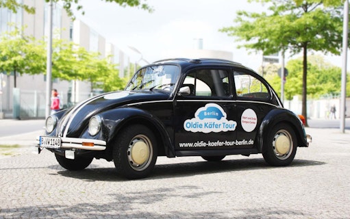 VW Beetle parked on a Berlin street for a 4-hour city tour.