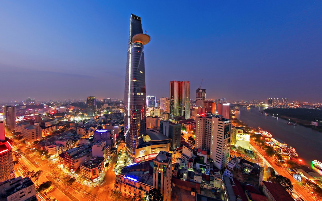 Saigon Skydeck view from Bitexco Financial Tower overlooking Ho Chi Minh City at dusk.