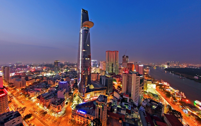 Saigon Skydeck view from Bitexco Financial Tower overlooking Ho Chi Minh City at dusk.