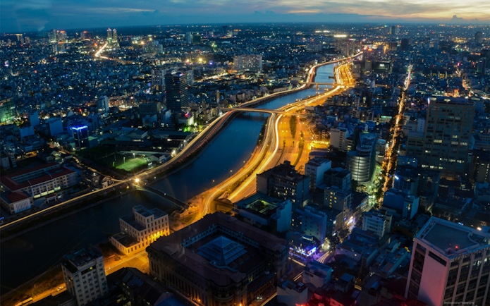 Aerial view of Ho Chi Minh City at night from Saigon Skydeck, Bitexco Financial Tower.