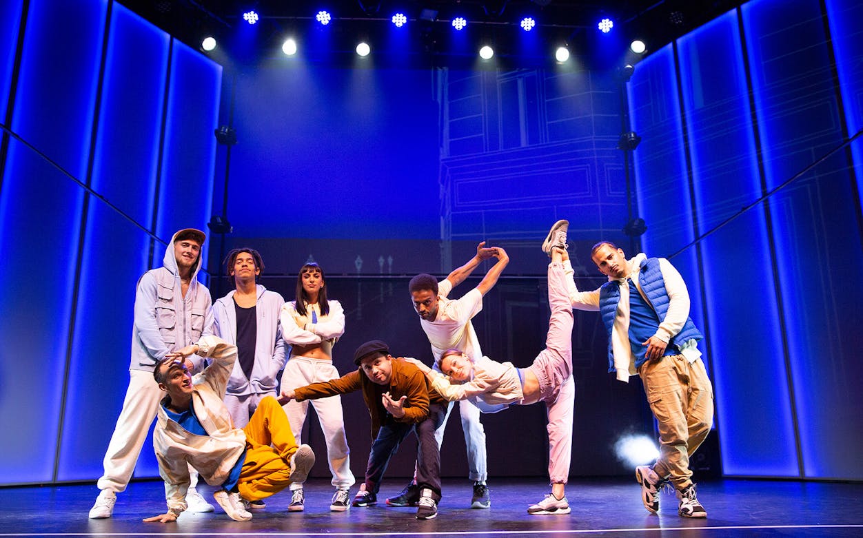 Performers on stage blending street dance and variety show elements in "Flying Dreams.