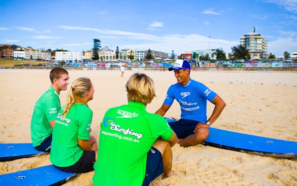 Surf instructor with students on Bondi Beach during a 2-hour surf lesson.