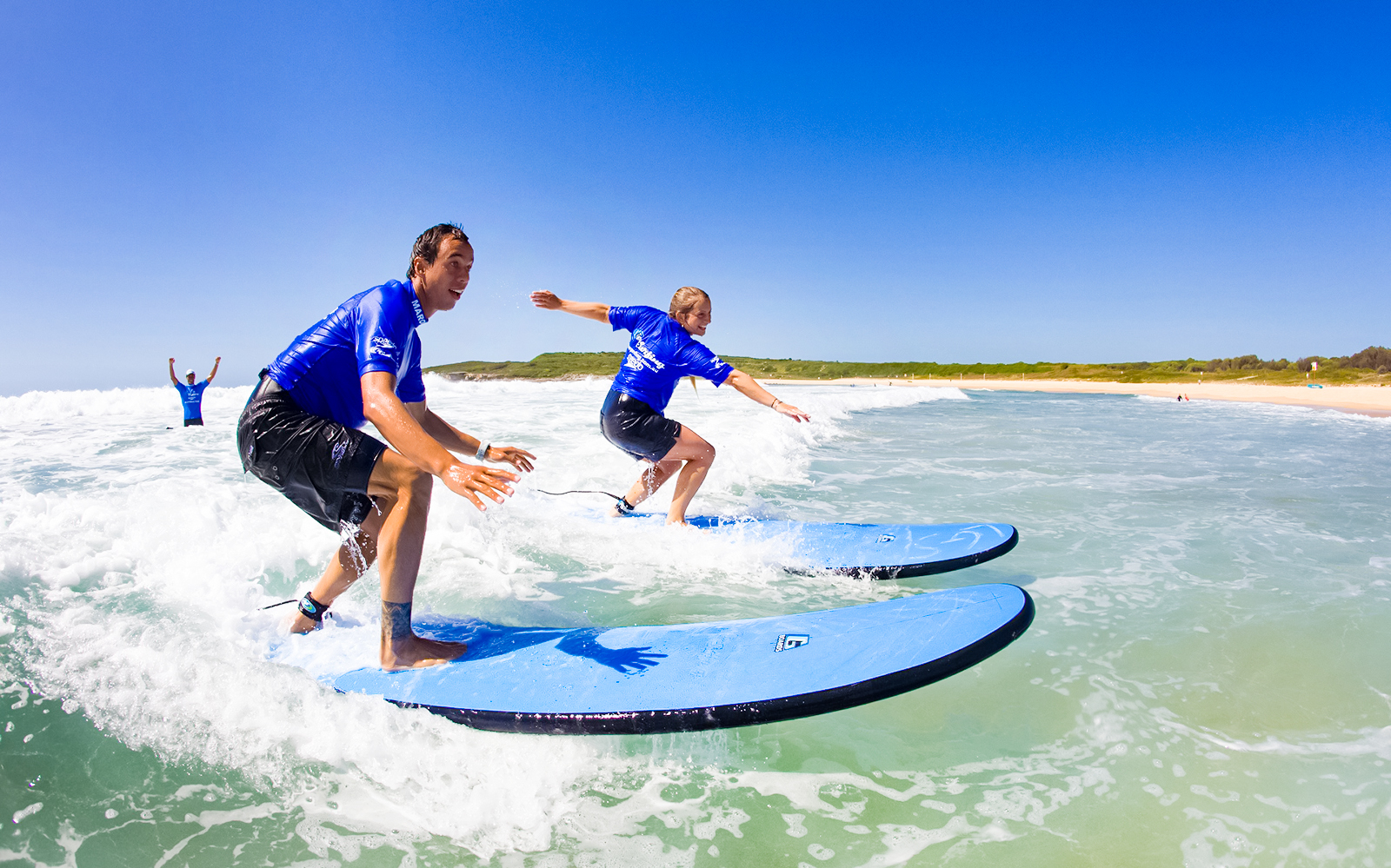 Surfers learning to ride waves at Maroubra Beach, Sydney.
