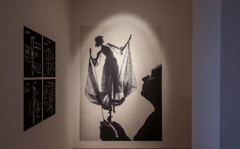 Puppet display and design sketches at Theatre Museum exhibit.