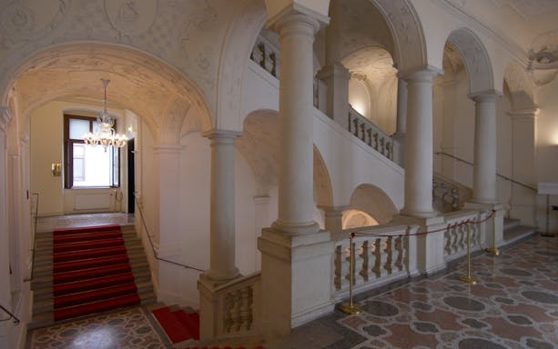 Grand staircase and ornate arches inside Theatre Museum.
