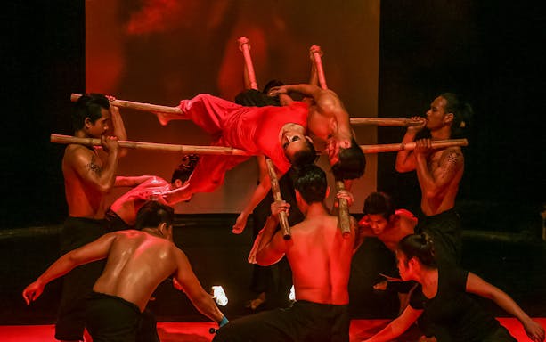 Performers balancing on bamboo poles at Phare, The Cambodian Circus.