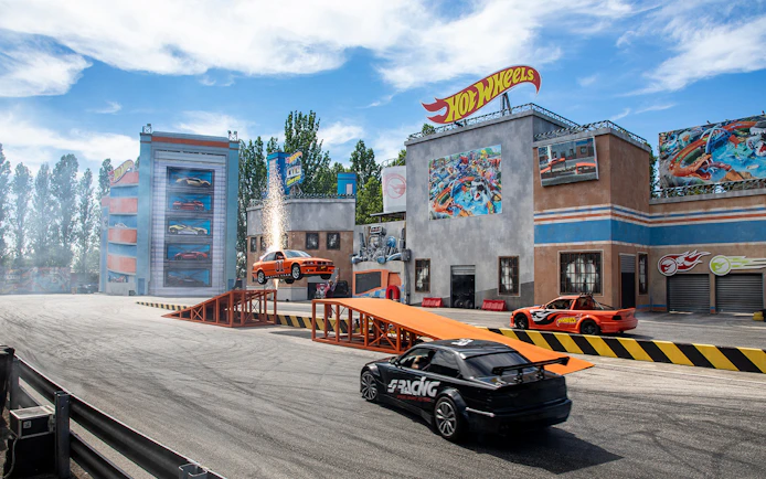 Stunt cars performing at Hot Wheels City in Mirabilandia theme park.