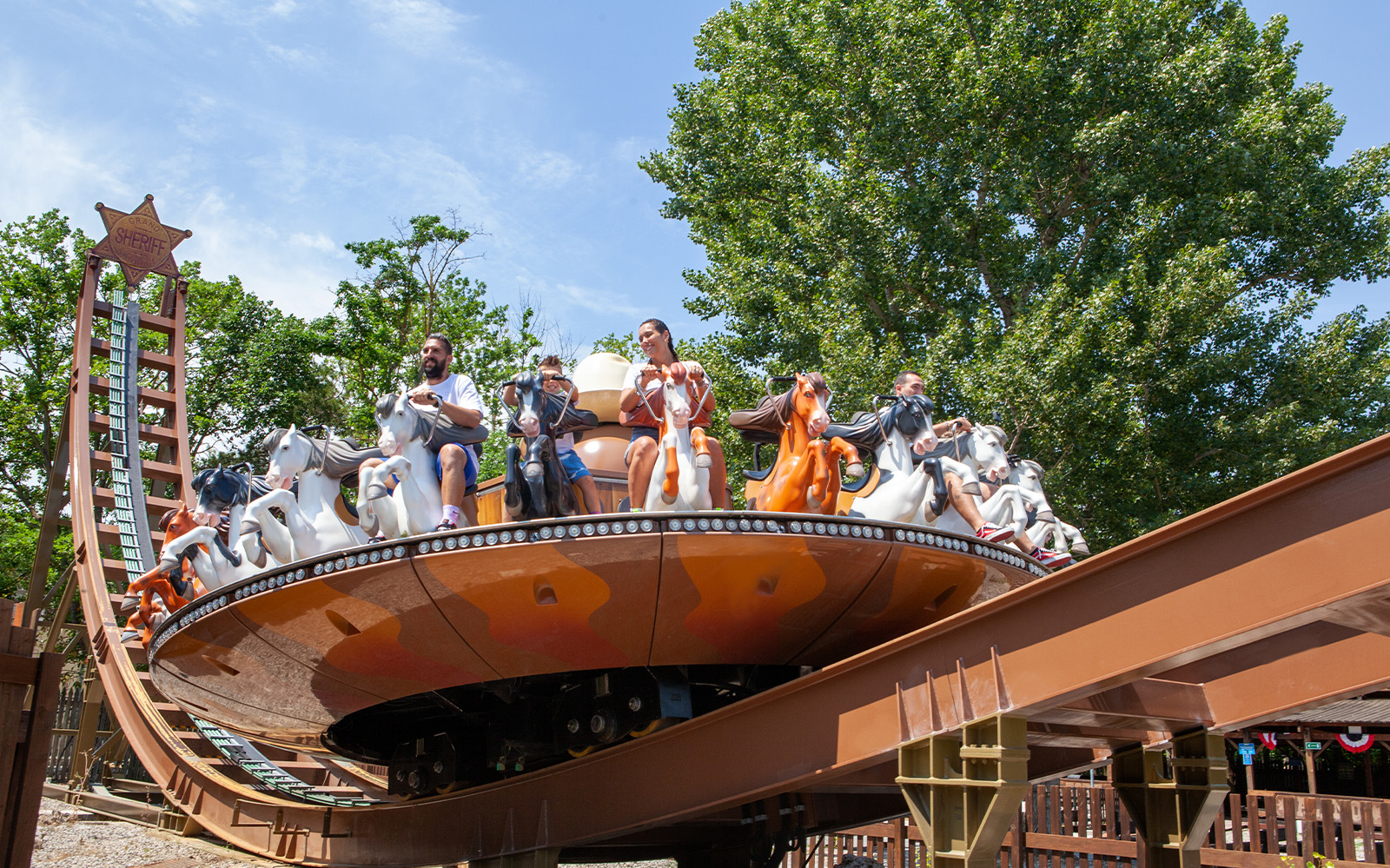 Visitors enjoying a spinning ride at Mirabilandia amusement park.