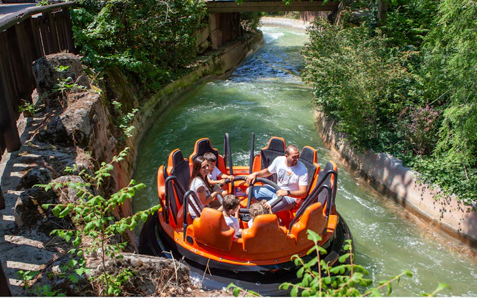 Raft ride at Mirabilandia's Mirabeach with people enjoying the water attraction.