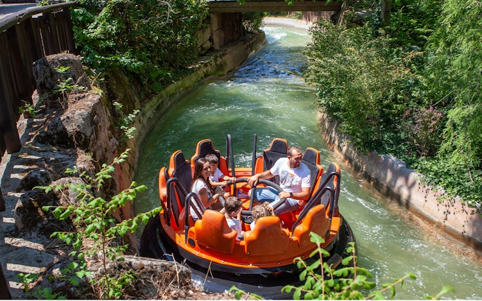 Raft ride at Mirabilandia's Mirabeach with people enjoying the water attraction.