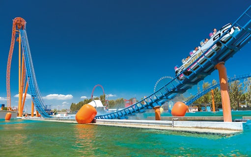 Roller coaster at Mirabilandia theme park, Italy, with water ride at Mirabeach.