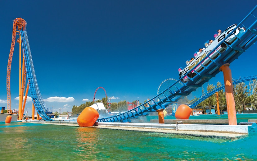 Roller coaster at Mirabilandia theme park, Italy, with water ride at Mirabeach.