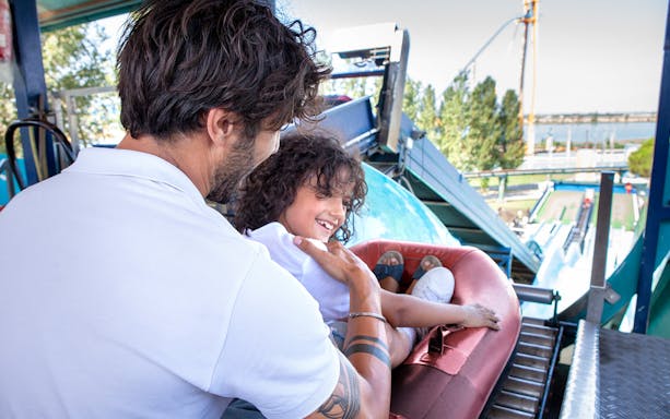 Father and child on water ride at Mirabilandia's Mirabeach.