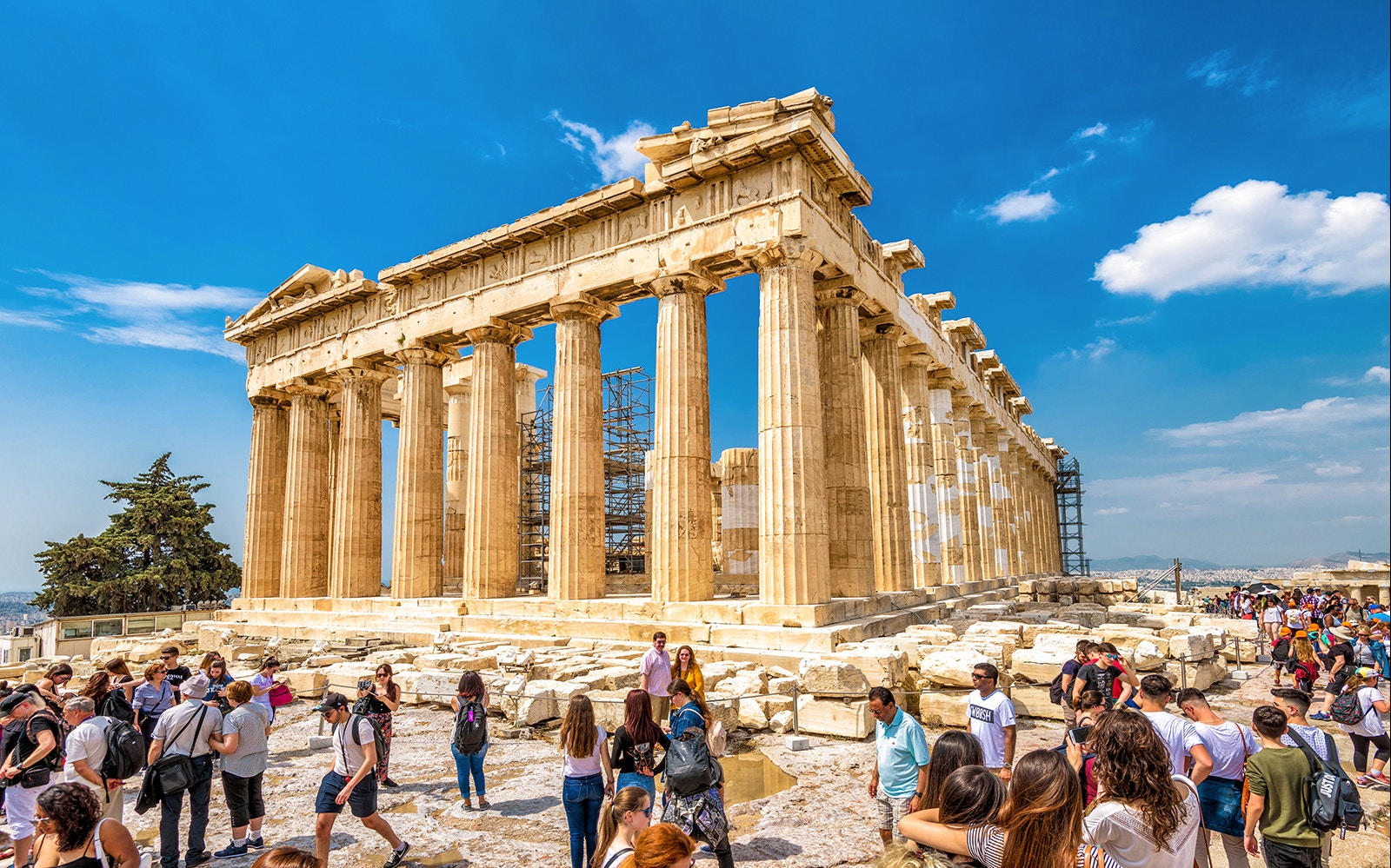 Visitors exploring the Parthenon on the Acropolis of Athens during a morning walking tour.