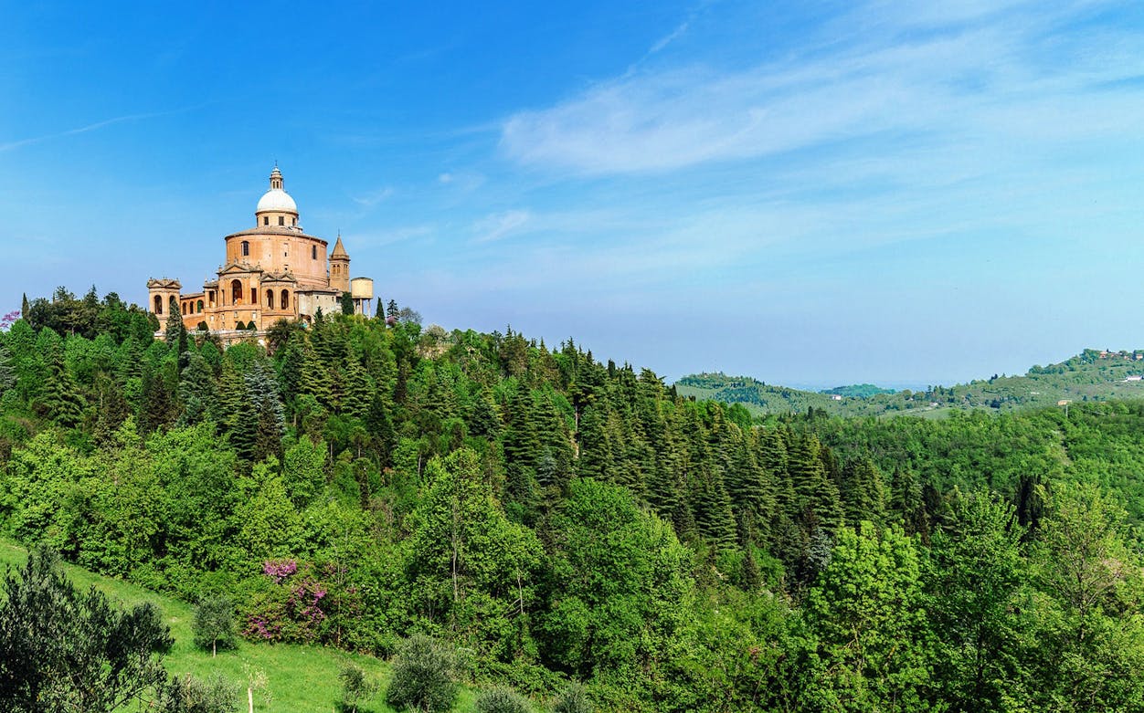 Sanctuary of the Madonna di San Luca on a hill surrounded by greenery, Bologna.