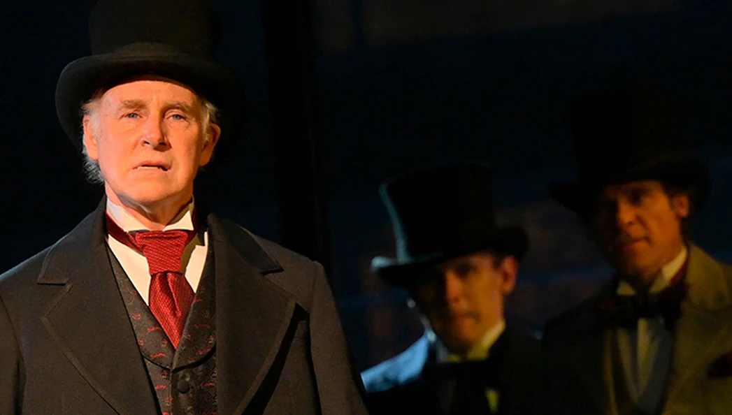 Gentleman in period costume with top hat at Paradise Square performance.